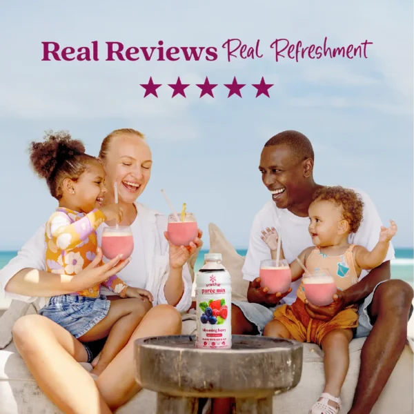 A smiling family sitting outdoors near the ocean enjoys berry smoothies together while a bottle of Smartfruit Blooming Berry purée mix sits on a table in front of them. Text above reads “Real Reviews, Real Refreshment” with five stars.