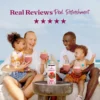 A smiling family sitting outdoors near the ocean enjoys berry smoothies together while a bottle of Smartfruit Superfruit Allstars purée mix sits on a table in front of them. Text above reads “Real Reviews, Real Refreshment” with five stars.