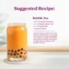 A glass of bubble tea with tapioca pearls served in a clear glass. Text shows a suggested recipe for Bubble Tea made with Tropical Harmony purée, brewed black tea, whole milk, and tapioca pearls.