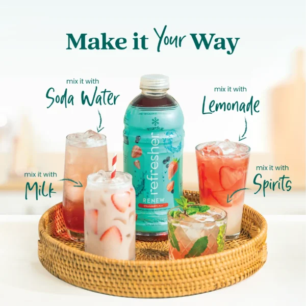 A Smartfruit Renew Refresher bottle placed on a woven tray surrounded by different drink options including a refresher with soda water, lemonade, milk, and a cocktail with mint garnish. Text highlights ways to mix the product including soda water, lemonade, milk, and spirits.
