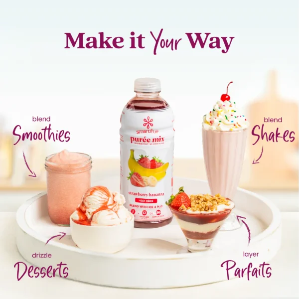 A Smartfruit Strawberry Bananza purée mix bottle displayed on a white tray surrounded by strawberry banana desserts and drinks including smoothies, milkshakes, parfaits, and ice cream. Text highlights different uses: smoothies, shakes, desserts, and parfaits.