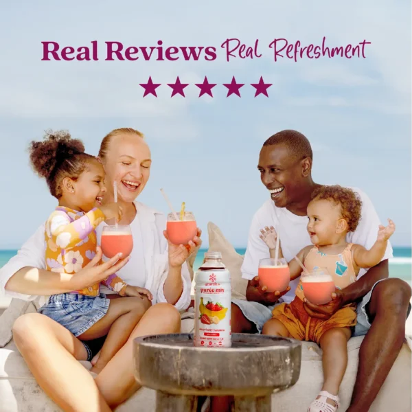 A smiling family sitting outdoors near the ocean enjoys strawberry smoothies together while a bottle of Smartfruit Strawberry Bananza purée mix sits on a table in front of them. Text above reads “Real Reviews, Real Refreshment” with five stars.