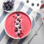 Top down view of a watermelon love bowl garnished with blueberries