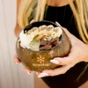 Woman holding a coconut bowl