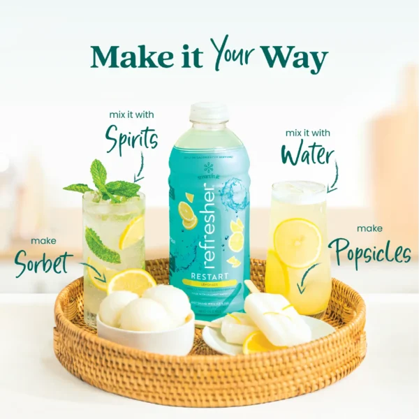 A Smartfruit Restart Lemonade Refresher bottle placed on a woven tray surrounded by different drink ideas including a mint lemonade cocktail, a classic lemonade refresher, lemon sorbet, and lemonade popsicles. Text highlights ways to enjoy the product including mixing with spirits, mixing with water, making sorbet, or making popsicles.