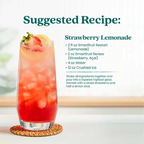 A tall glass of pink strawberry lemonade drink filled with ice and garnished with a fresh strawberry and lemon slice. Text shows a suggested recipe called Strawberry Lemonade made with Smartfruit Restart Lemonade, Smartfruit Renew Strawberry Açaí, water, and crushed ice.