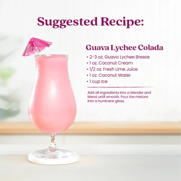 A light pink Guava Lychee Colada mocktail served in a hurricane glass with a pink cocktail umbrella garnish. To the right, text reads “Suggested Recipe: Guava Lychee Colada” with ingredients including Guava Lychee Breeze, coconut cream, fresh lime juice, coconut water, and ice, followed by instructions to blend until smooth and pour into a hurricane glass.