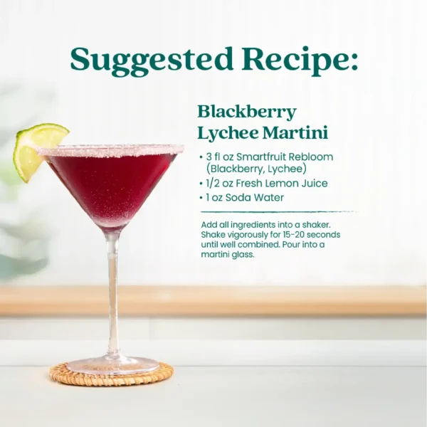 A blackberry lychee martini served in a martini glass with a lime garnish. Text shows a suggested recipe made with Smartfruit Rebloom, lemon juice, and soda water.