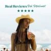 A woman wearing a straw hat stands at the beach while drinking a peach-colored refresher beverage through a straw. Text above reads “Real Reviews, Real Refreshment” with five stars.