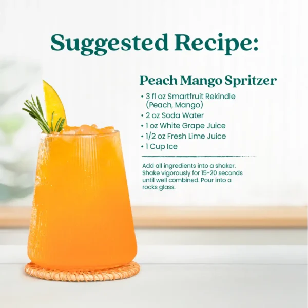 A bright peach-colored drink served in a textured glass with ice and a peach wedge garnish. Text shows a suggested recipe called Peach Mango Spritzer made with Smartfruit Rekindle Refresher, soda water, white grape juice, fresh lime juice, and ice.